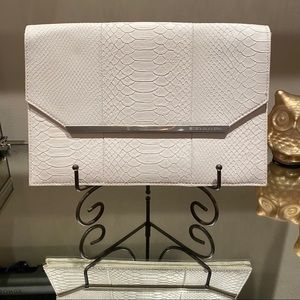 BCBG white faux alligator clutch